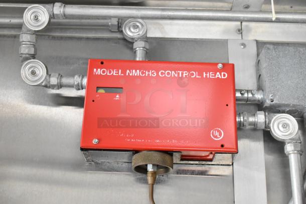 Red Model NMCH3 Control Head in food trailer, used for fire safety. Features UL certification mark, metallic fixtures.