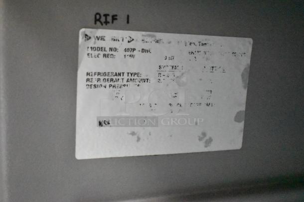 Blurry label on a food trailer appliance, showing partial model and electrical requirements details.