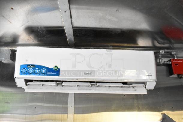 Air O Matic inverter air conditioner inside a 2019 outfitted food trailer, mounted on a metal ceiling, includes control panel.