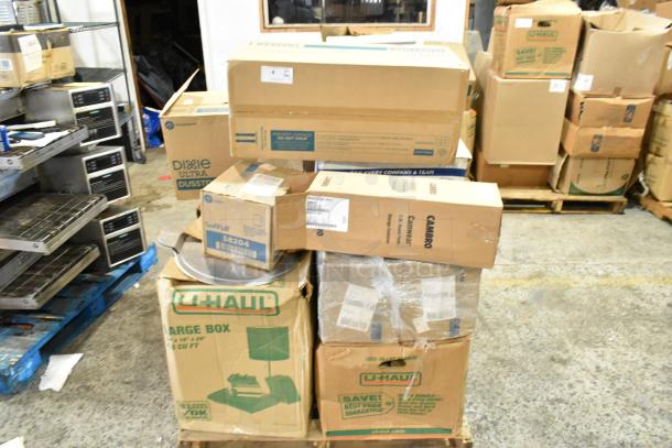 17 boxes including Cambro containers, cutlery dispenser, towel dispenser. Some labeled Dixie Ultra, Soft Pull, U-Haul. Scratch and dent condition.
