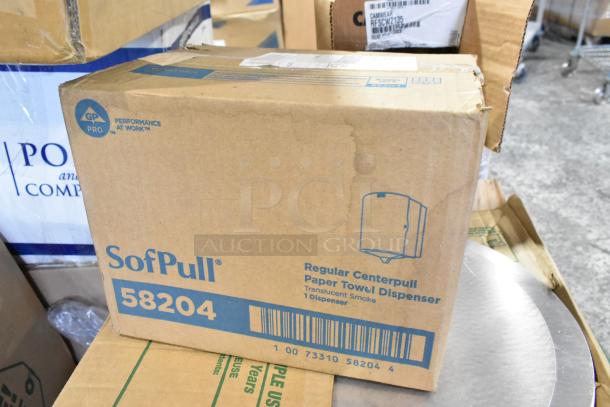 Box containing a SofPull paper towel dispenser, model 58204. Marked as regular centerpull in translucent smoke. Brand new condition.