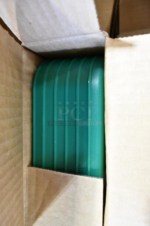 Cardboard box containing new green Cambro container with ribbed design. Part of a bulk auction lot of new scratch and dent items.