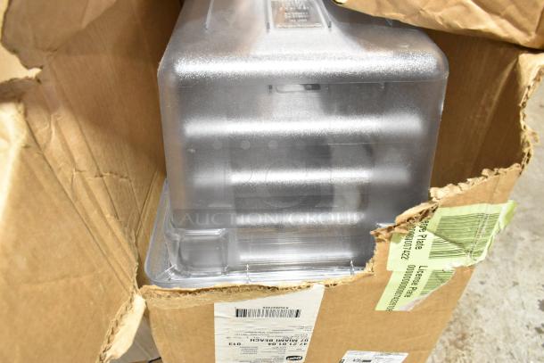 Boxes with Cambro containers and dispensers, new condition with minor dents. Labels and barcodes visible. 17 items total.