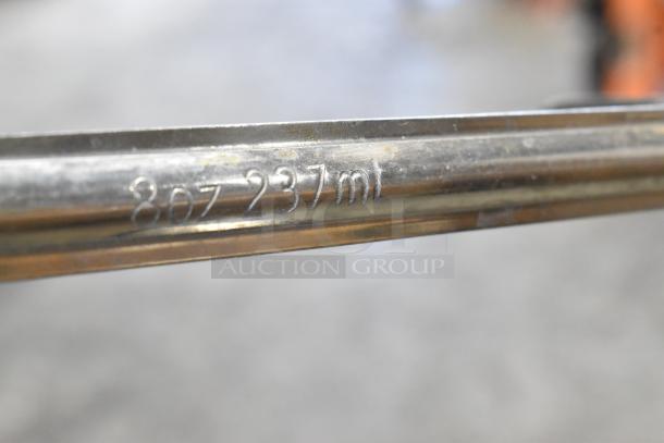 Metal rod with "8oz 237ml" engraved, part of 16 new scratch and dent boxes including ladles, colander, Camwear bins.