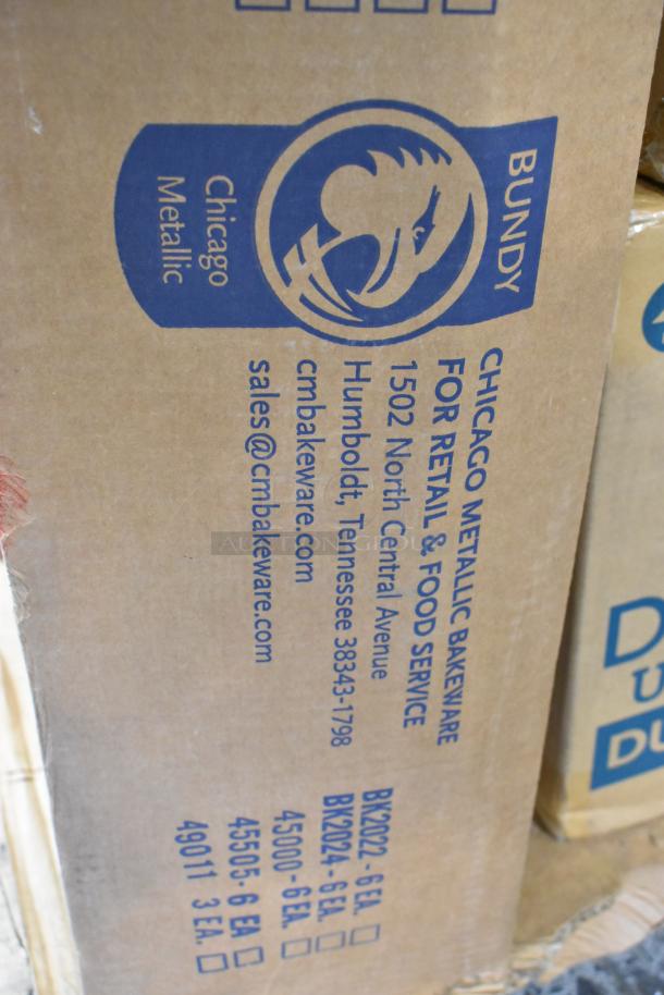 Cardboard box labeled "Chicago Metallic Bakeware," with contact info and product codes. Contains new kitchen items.