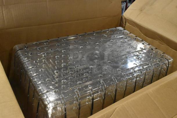 Box containing new scratch and dent Camwear bins. Clear plastic design, visible through brown cardboard.