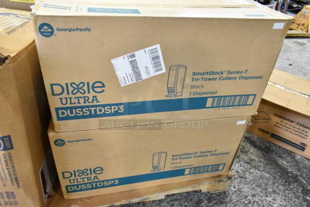Cardboard boxes labeled "Dixie Ultra" SmartStock Series-T Cutlery Dispenser and Camwear Colander, new condition.