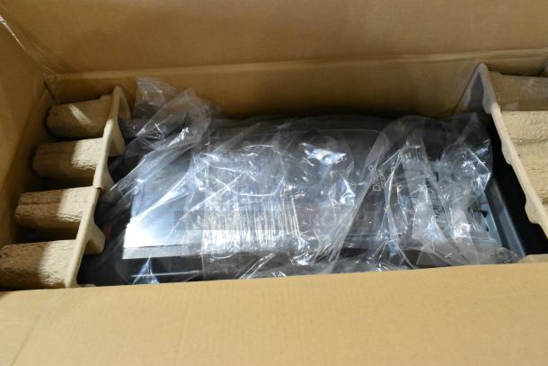 Cardboard box containing new kitchen items, such as ladles and colander, wrapped in plastic. Scratch and dent condition.