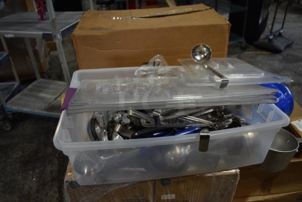 Boxes of kitchen items, including ladles, colander, and Camwear bins. Scratch and dent condition. 16 sets available.