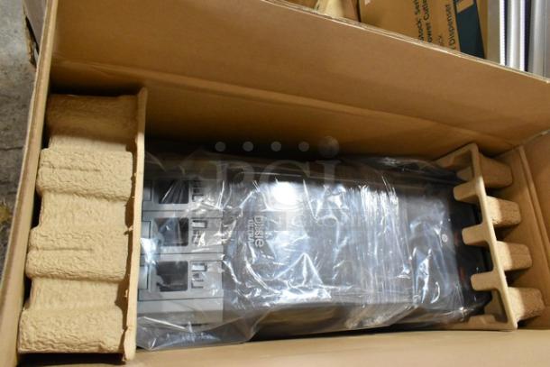 New Dixie cutlery dispenser in original packaging, slightly dented. Includes multiple items. Ideal for bulk purchase.