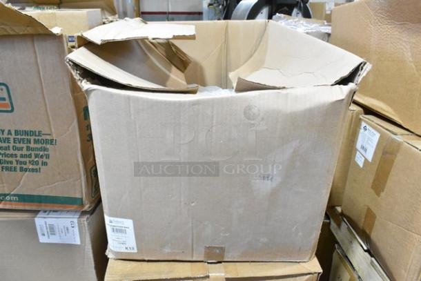 Cardboard box labeled "K13" containing new scratch and dent items. Includes Carlisle food pan smart lids and to-go containers.