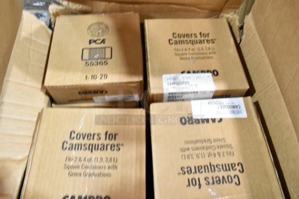 Cardboard boxes containing Carlisle food pan smart lids and to-go containers. Labels indicate scratch and dent condition.
