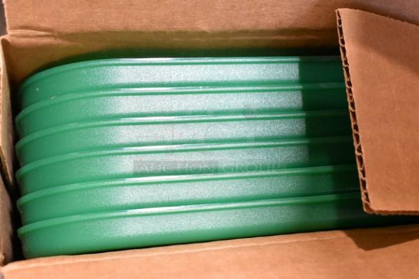Cardboard box containing green Carlisle Food Pan Smart Lids. Items are brand new, marked as scratch and dent.