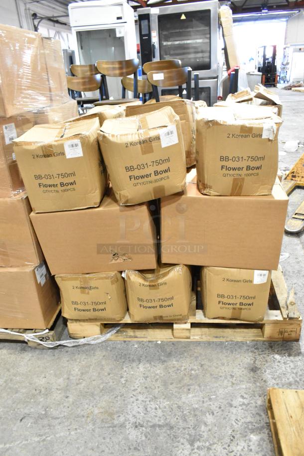 Boxes of BB-031-750ml Flower Bowls and ProPak Paper Handle Bags on a pallet. Some boxes show minor damage.