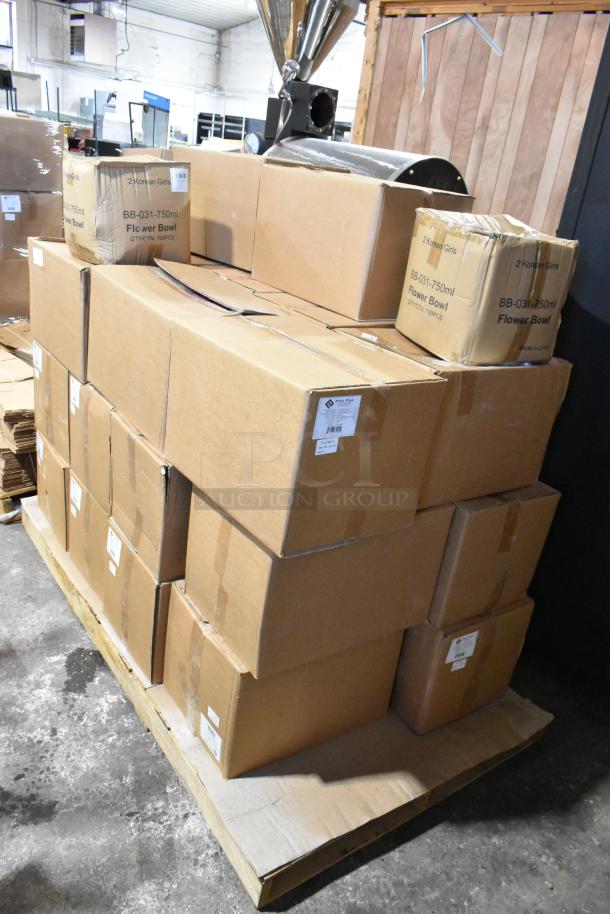 Stack of 25 new scratch and dent boxes on a pallet, including ProPak paper handle bags and BB-031-750ml flower bowls.