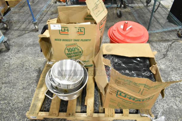 22-item set including colanders, Winco bread pans, Cambro containers, Chef Master salad spinner. U-Haul boxes visible.
