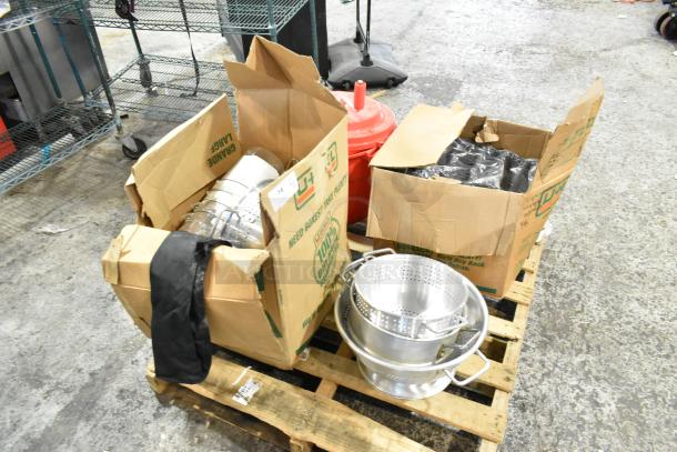 22 kitchen items including colanders, Winco baking pan liners, Cambro containers, and Chef Master salad spinner on a pallet.