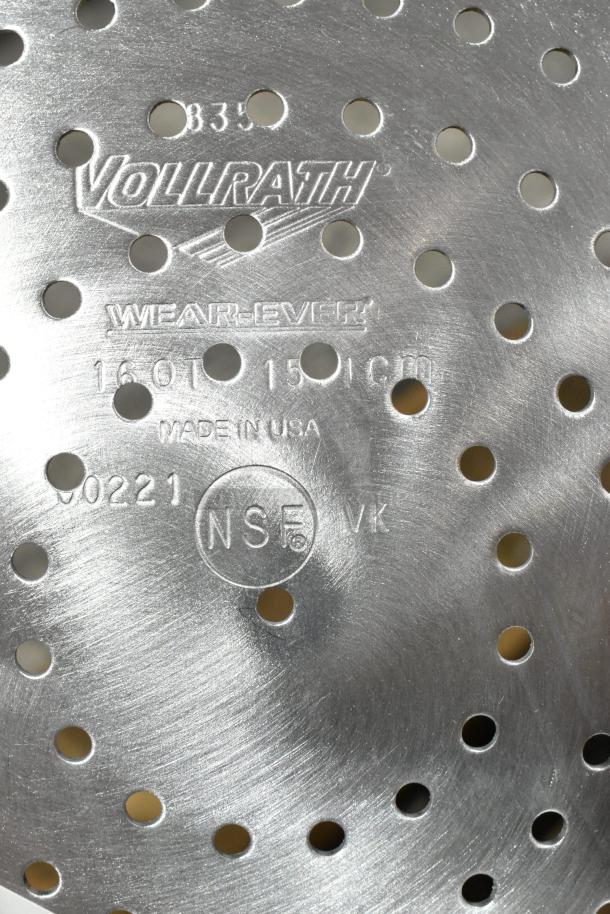 Vollrath Wear-Ever colander, perforated metal, marked "Made in USA" and "NSF." Part of 22 assorted kitchen items.