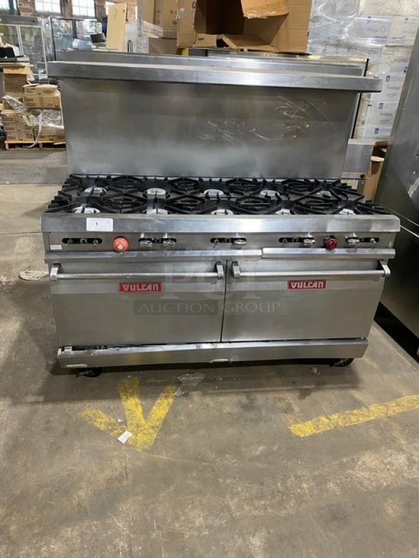 Vulcan stainless steel 10-burner range with double oven, backsplash, and overhead salamander shelf on casters. Includes wired rack.