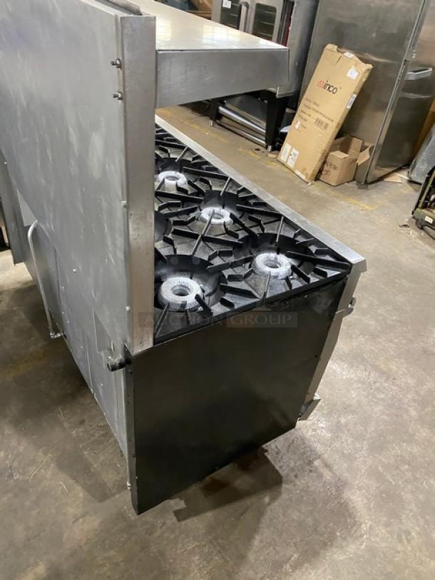 Vulcan Commercial 10-burner range, stainless steel, natural gas, double oven combo, with backsplash, salamander shelf, on casters.