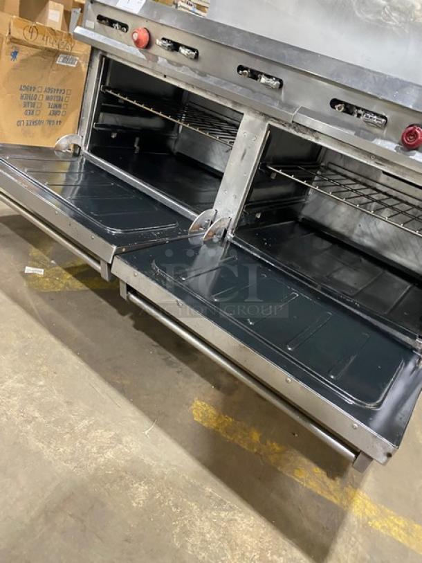 Vulcan commercial stainless steel 10-burner range, natural gas, dual oven, backsplash, salamander shelf, wired rack, on casters.