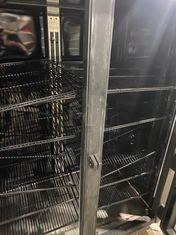 True Commercial double glass swing door refrigerator, model STG2RPTVLD2G2SHC, with poly coated wire racks, on casters.