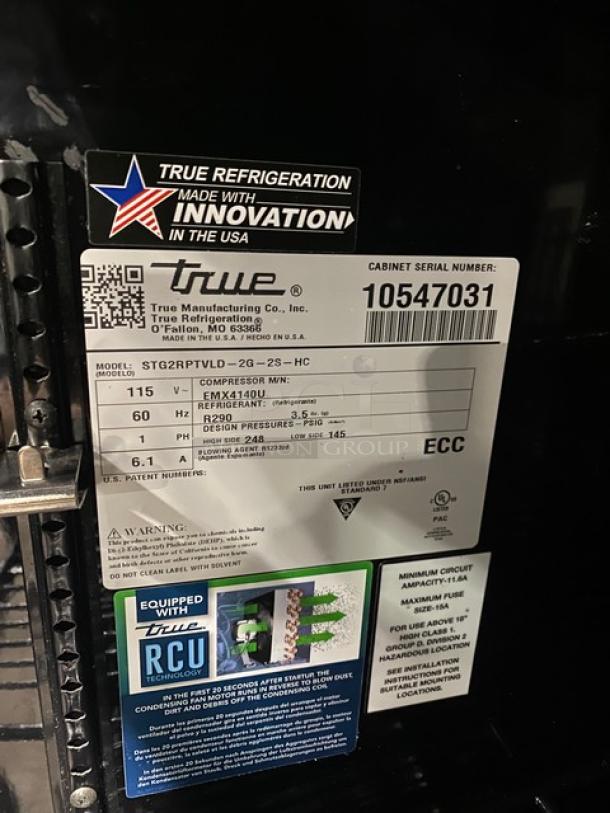 True Commercial Black Double Glass Swing Door Reach-In Refrigerator, Model STG2RPTVLD-2G-2S-HC, 115V, with poly-coated wire racks.