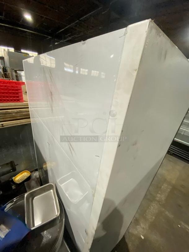 True GDM-49F commercial freezer, double glass swing doors, poly-coated wire racks, 115/208-230V, 1 phase, minor scratches.