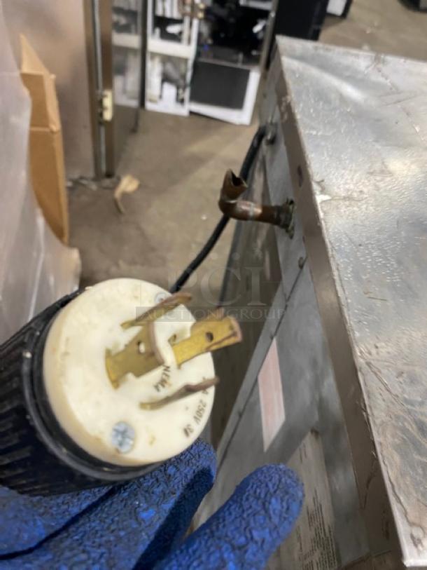 Hoshizaki KM-630MAH ice machine head, stainless steel, electric, air-cooled, 208-230V, 1 Phase. Visible plug connection.