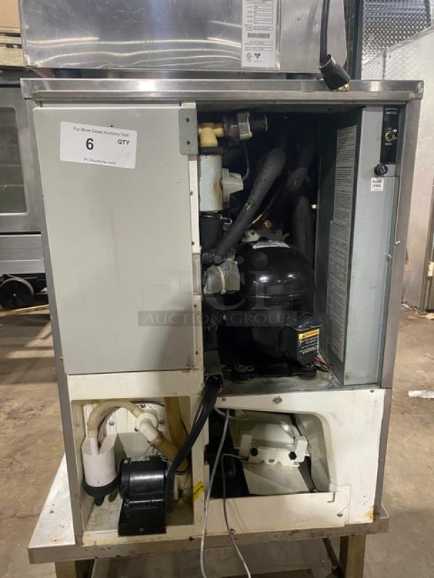Hoshizaki KM-515MAH commercial ice maker, stainless steel, air-cooled, Energy Star certified, 115V, internal components visible.