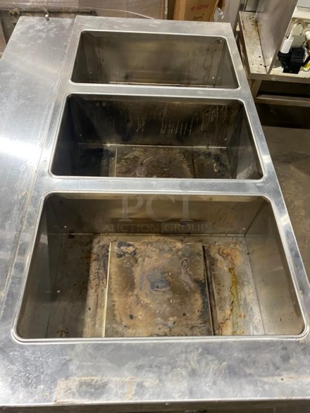 Diamond Commercial Stainless Steel 3-Well Steamtable with individual controls, model GST48-30, used condition, on legs.