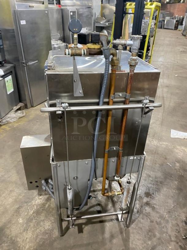 Jackson TempStar Series commercial stainless steel door-type dishwasher, electric-powered, freestanding on legs, in used condition.