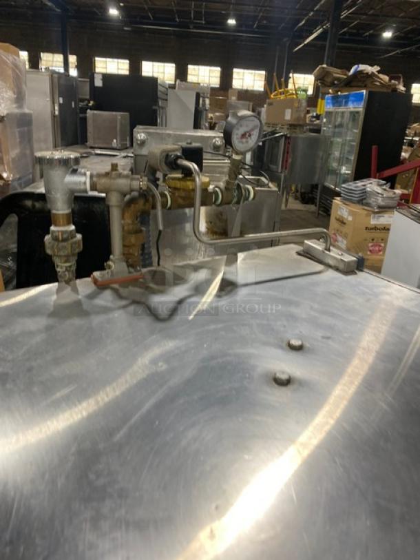 Jackson TempStar Series commercial stainless steel electric door-type dishwasher on legs, visible plumbing and gauges, used condition.