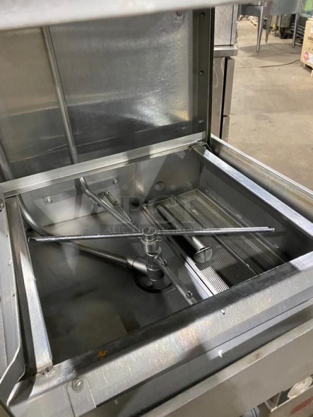 Jackson TempStar Series commercial dishwasher; stainless steel, door-type, electric powered, on legs, interior view.