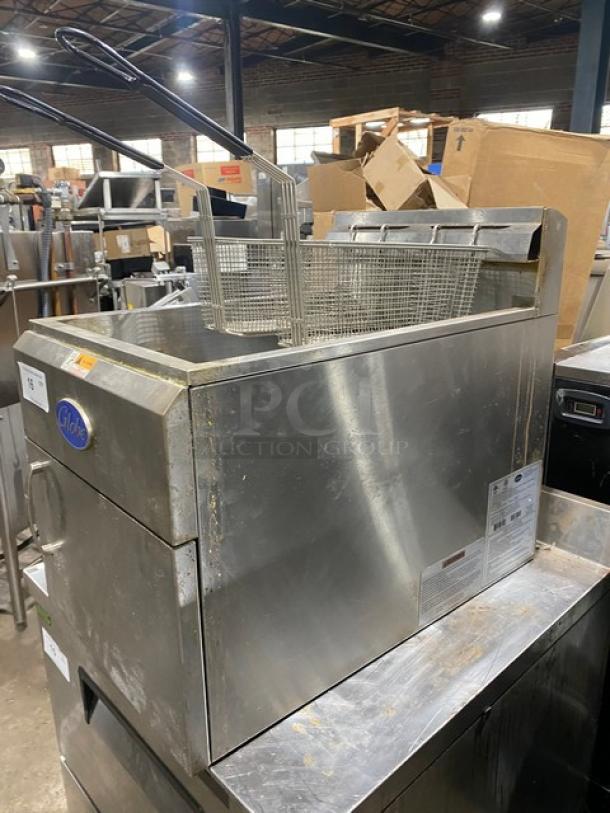 Globe GF30G 2021 commercial stainless steel countertop deep fryer with back splash, basket hanger, and fry baskets.