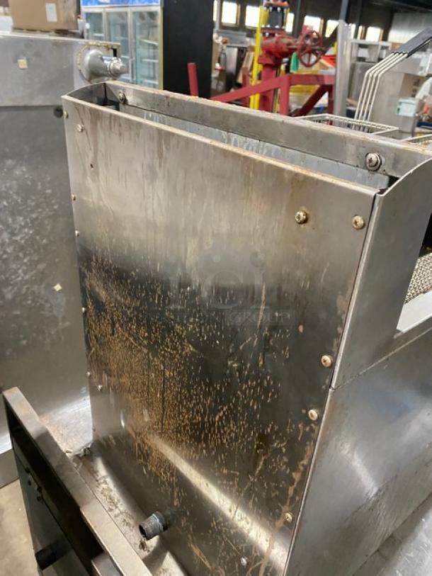Globe GF30G commercial stainless steel natural gas countertop deep fat fryer, 2021 model, with backsplash, basket hanger, and fry baskets.