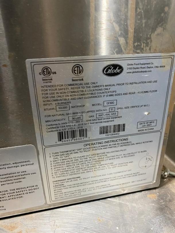 Globe GF30G commercial stainless steel natural gas countertop fryer with basket hanger. SN: 1521064402.