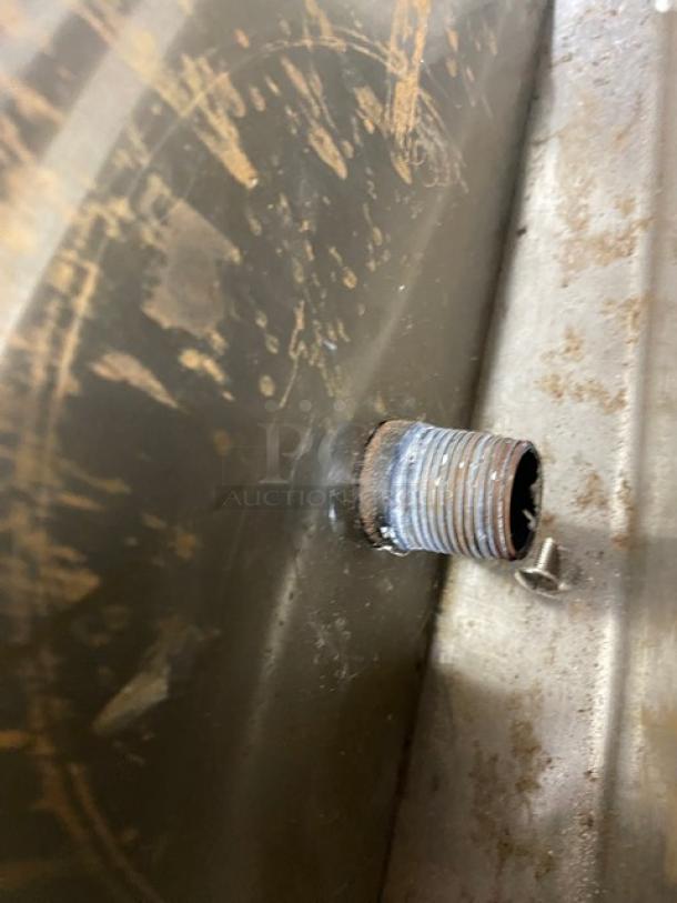 Close-up of a worn, threaded pipe and surrounding area on a Globe GF30G stainless steel deep fat fryer, model 2021.