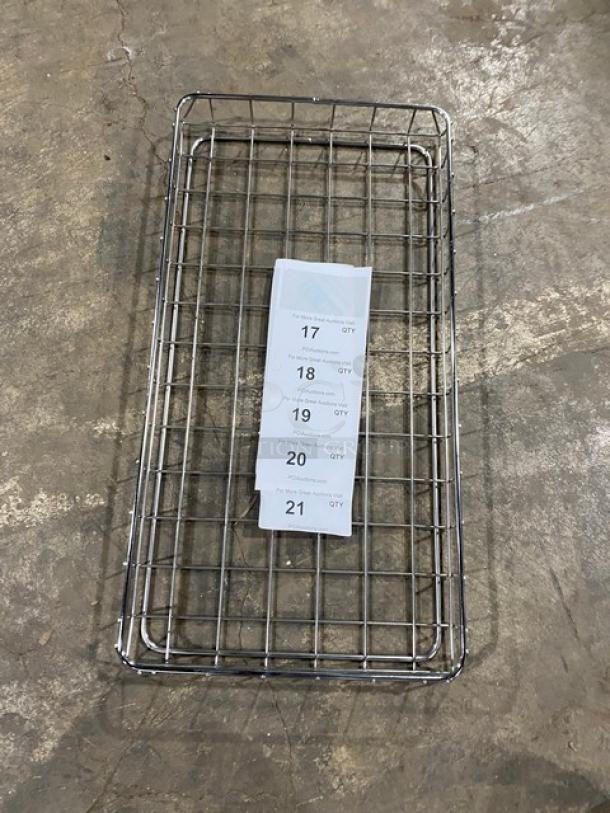 Commercial chrome-plated full-sized wired rack for bagels or pastries. Features durable construction. Visible tags listing quantities. Good condition.