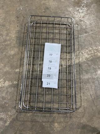 Commercial chrome-plated full-sized wired rack for bagels or pastries. Features durable construction. Visible tags listing quantities. Good condition.