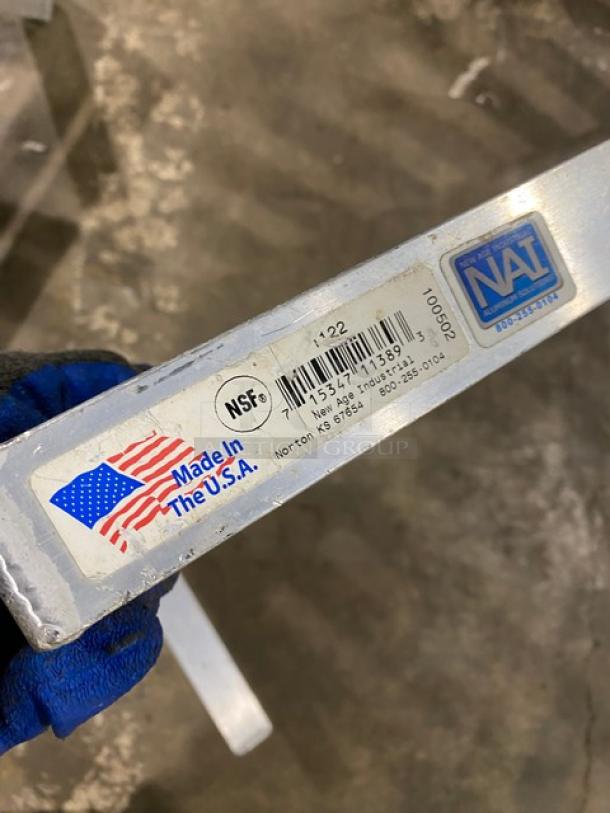 Commercial aluminum T-Bar wall shelf, made in the USA, NSF certified. Label shows NAI brand and New Age Industrial marking.
