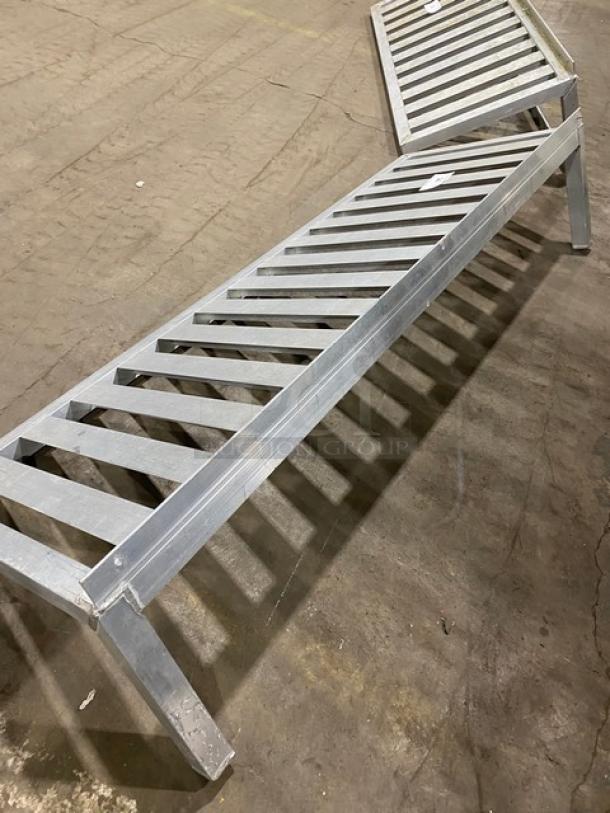 Commercial aluminum T-bar wall shelf, sturdy construction, metallic finish, minimal wear, ideal for industrial use.