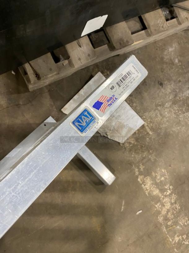 Commercial aluminum T-Bar wall shelf, featuring NSF certification and "Made in USA" label. Durable and ideal for storage.