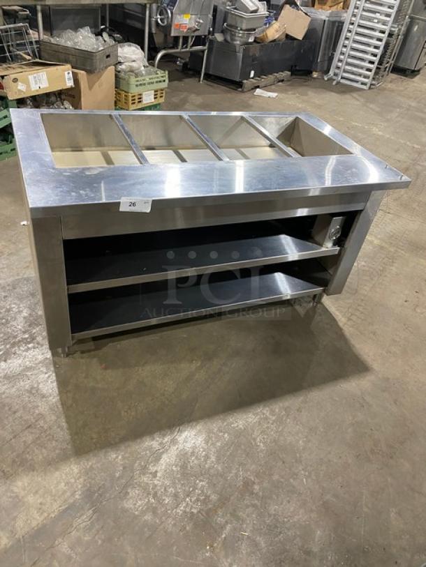 Cecilware commercial stainless steel 4-well hot food steamtable with enclosed double shelf base, on legs.