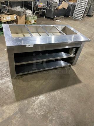 Cecilware commercial stainless steel 4-well hot food steamtable with enclosed double shelf base, on legs.
