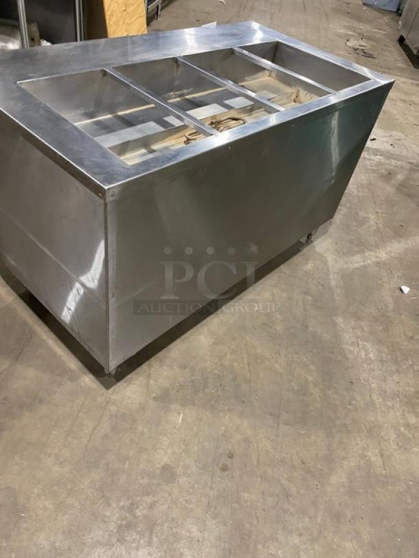 Cecilware stainless steel 4-well hot food steamtable, electric-powered, with enclosed double shelf base, on legs.