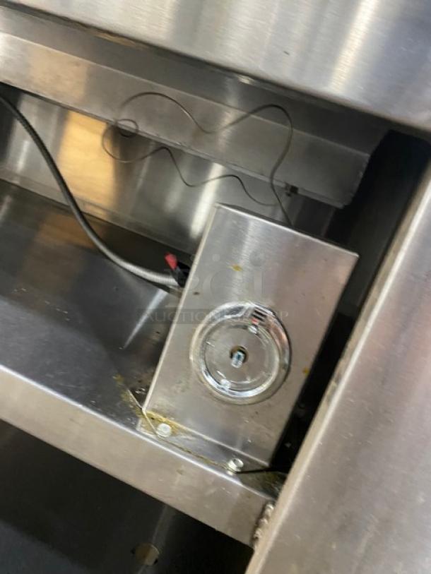 Cecilware commercial stainless steel electric 4-well hot food steam table with enclosed double shelf base, on legs, visible wiring.