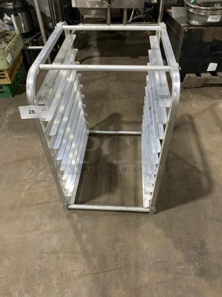 Commercial heavy-duty pan holding rack with multiple slots, made of durable metal, in good condition, label reads "28 QTY".