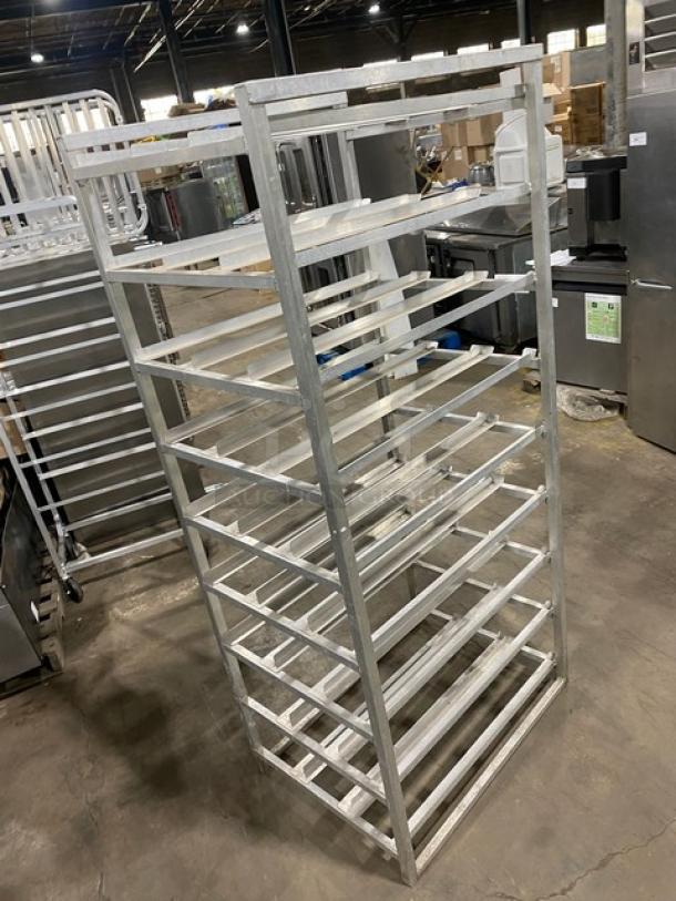 Channel commercial heavy duty pan holding/cooling rack with multiple shelves, metal construction, on sturdy legs, used condition.
