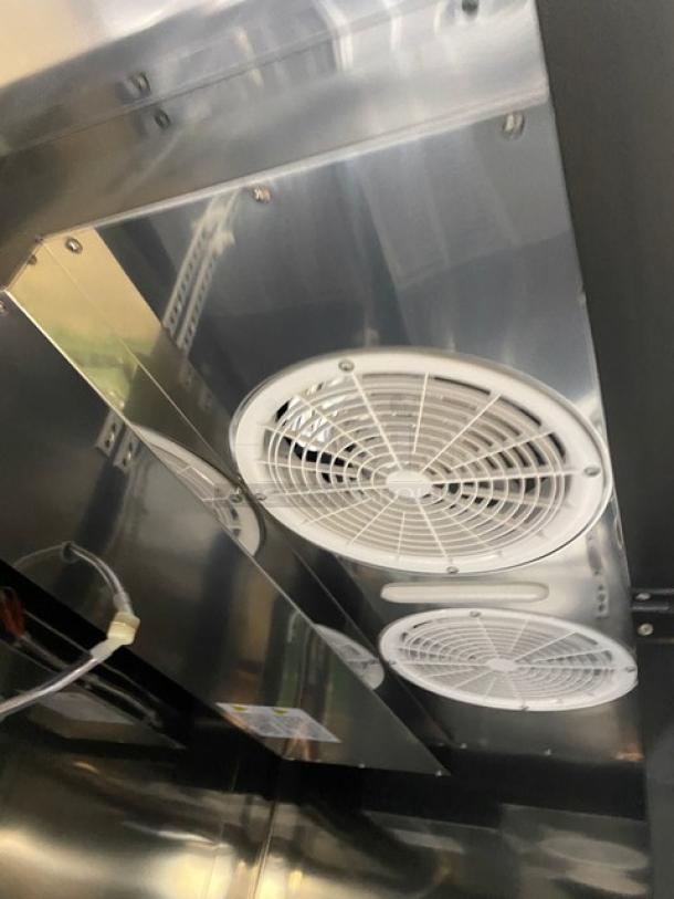 Kool-It KBSF2 commercial stainless steel 2-door freezer, Energy Star Certified, with poly-coated wire racks, interior view showing cooling fans.